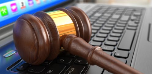 Online internet auction. Gavel on laptop.  3d